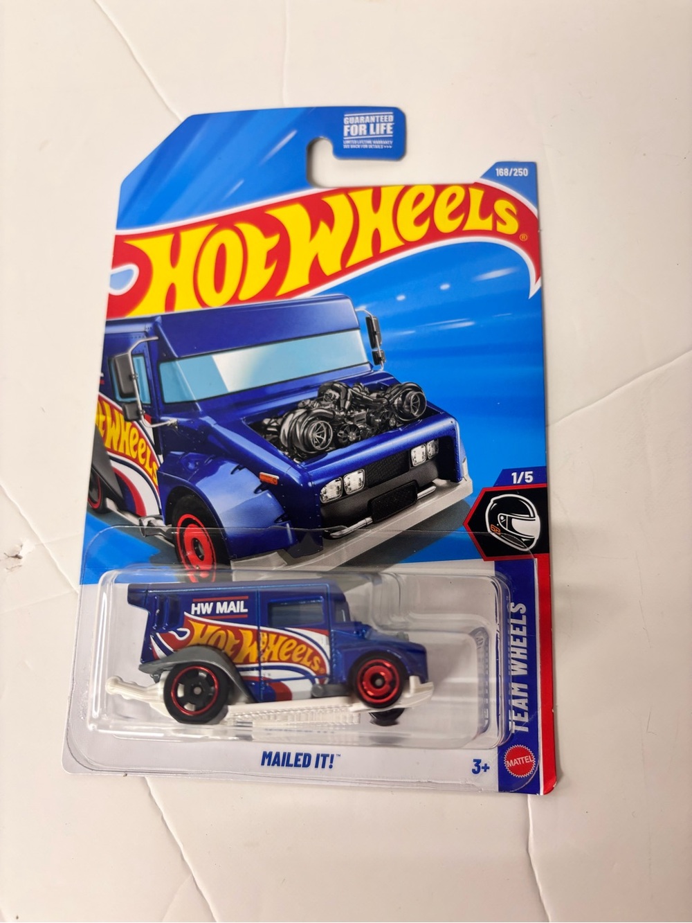 Mattel Hot Wheels Blue HW Mail Van with Red Wheel Accents 2026